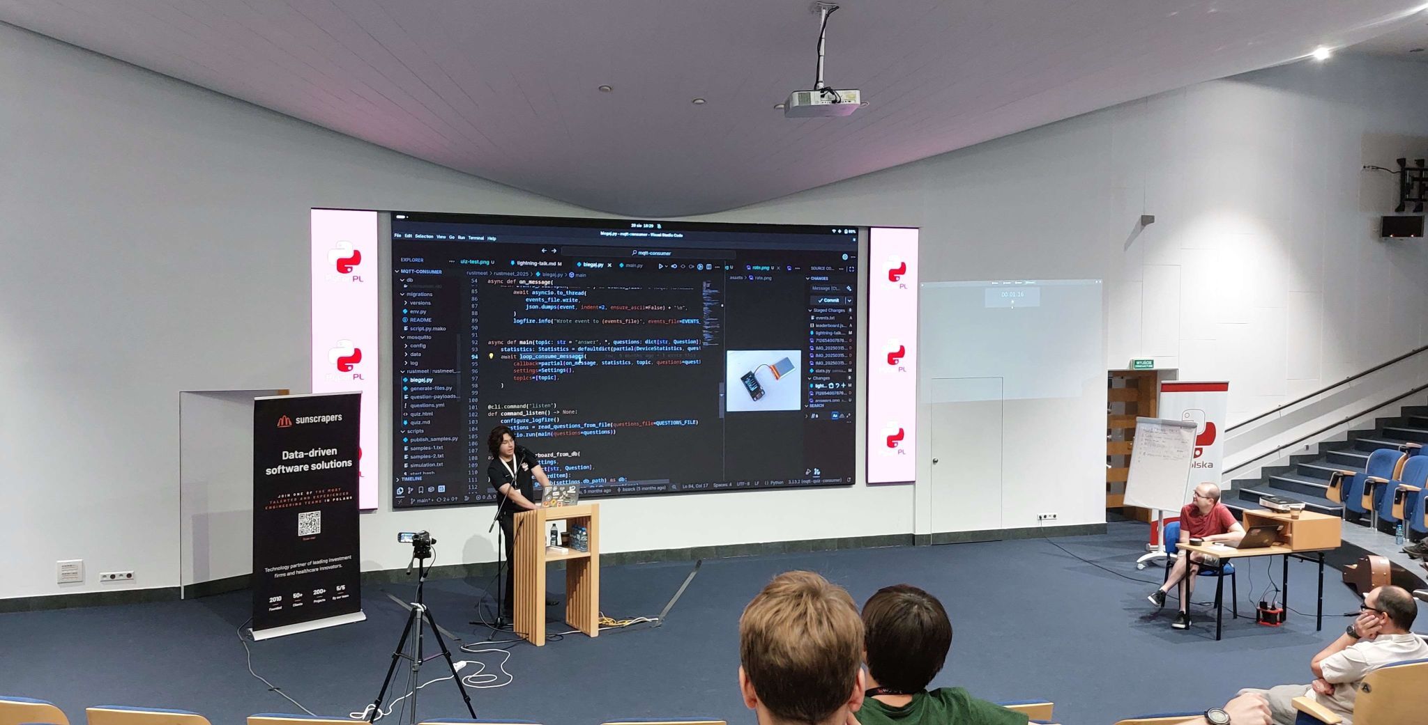Bartosz presenting Python code at PyCon PL.